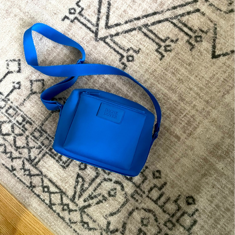 * Tiny defect on backside* Water resistant neoprene crossbody bag